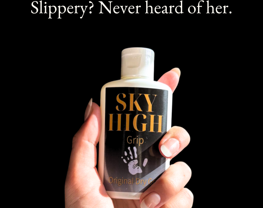 Hand holding a bottle of 'Sky High Grip' anti-slip grip aid with text on a black background